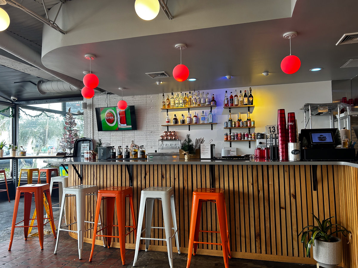 bar with red metal stools
